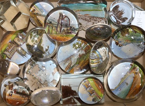 A group of reverse printed glass paperweights